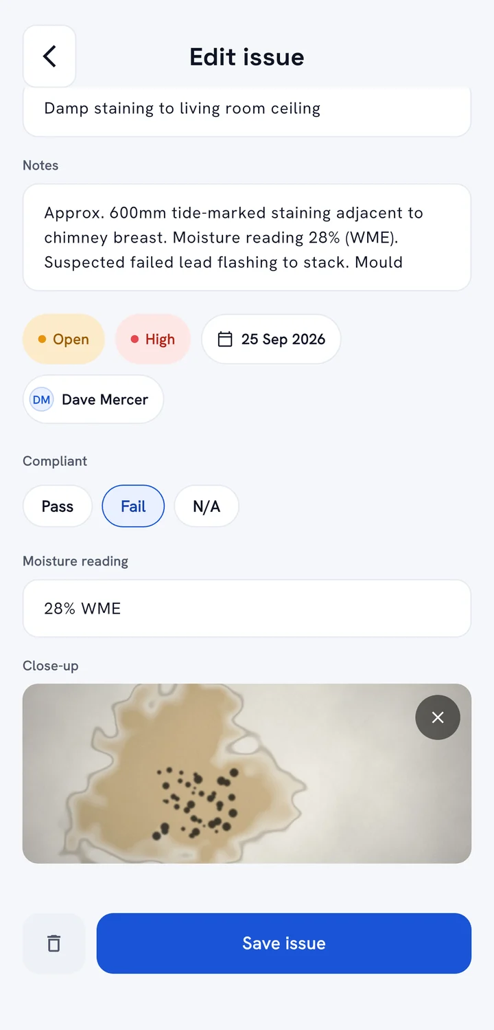 An issue showing custom fields: Compliant set to Fail, Moisture reading 28% WME and a close-up photo